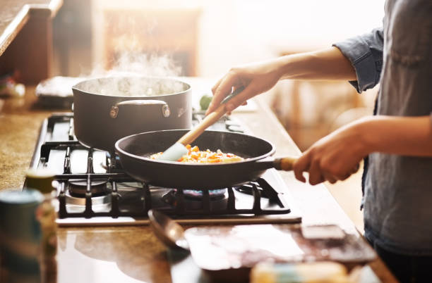 Person cooking in kitchen